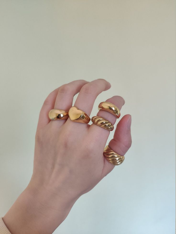 Because a lot of customer-friends love chunky rings, I made a collection of my wide rings. I hope you love these big golden rings. ♥ SIGN UP for 10% OFF your first order: https://bit.ly/3olIlWf ♥ DETAILS - Materials: Stainless steel, 18k gold plating. - Nickel-free, anti-corrosion, tarnish-resistant, and hypoallergenic. - Safe for sensitive skin. - Waterproof Ring: you can wear it while taking a shower or washing your hands. ♥ STYLE ⇨ A - Croissant Ring ⇨ B - Double Dome Ring ⇨ C - Themis Ring ⇨ Chunky Gold Rings Aesthetic, Big Gold Rings, Bulky Rings, Gold Chunky Rings, Big Gold Ring, Chunky Gold Rings, Skincare Christmas, 5 Gold Rings, Thick Rings