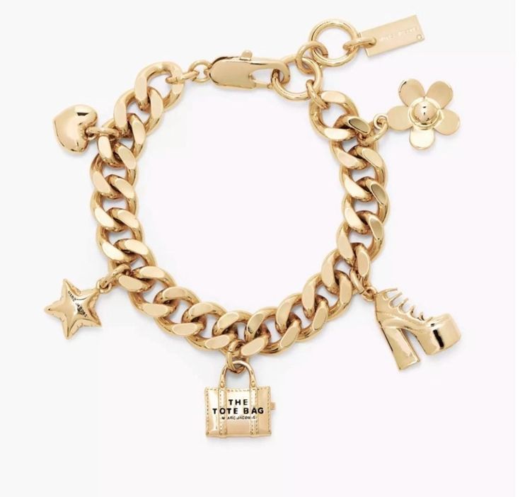 This charm bracelet reimagines the Marc Jacobs icons to new heights with charms designed after our signature tote bag and more.  Gold-plated / Silver-plated brass Lobster clasp Brand New without tag. No dust bag included. Marc Jacobs Charm Bracelet, Marc Jacobs Bracelet, Marc Jacobs Jewelry, Gold Plated Silver, Women Accessories Jewelry, Charm Bracelets, Luxury Items, Lobster Clasp, Favorite Jewelry