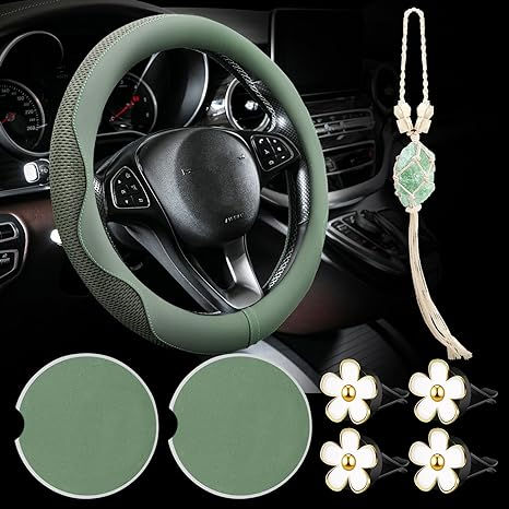 the steering wheel cover is green with white flowers and beads hanging from it's center