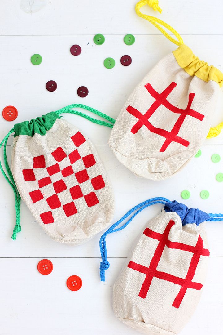 two bags with red and white crosses on them