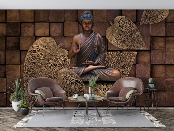 a buddha statue sitting on top of a wooden wall next to two chairs and a table