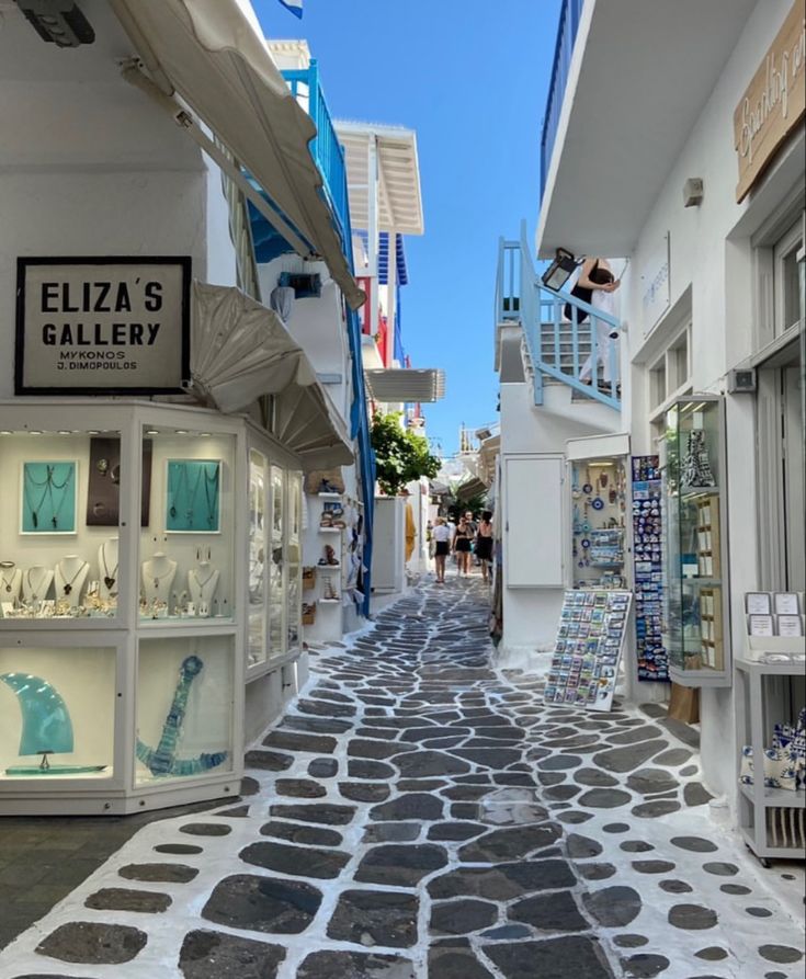 an alley way with shops and stores on both sides