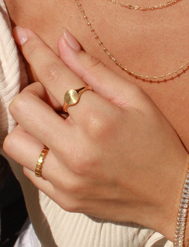 Details: Make a statement with our Coco Ring! Made with gold plated stainless steel, this ring is perfect for everyday wear. You can confidently stack your rings without worrying about any tarnishing. Our Coco Ring is also skin friendly and waterproof, so you can wear it all day and even to the beach! It's a great addition to your jewelry collection and adds a touch of elegance to any outfit. * Gold Plated Stainless Steel (PVD Plating) * Size Options: US 6 - 8 ►WATER-SAFE: Our jewelry uses a spe Coco Ring, Rings Minimal, White Sliders, Rings Everyday, Summer Rings, Minimal Ring, Gold Signet Ring, Gold Ring Stack, Minimal Jewelry