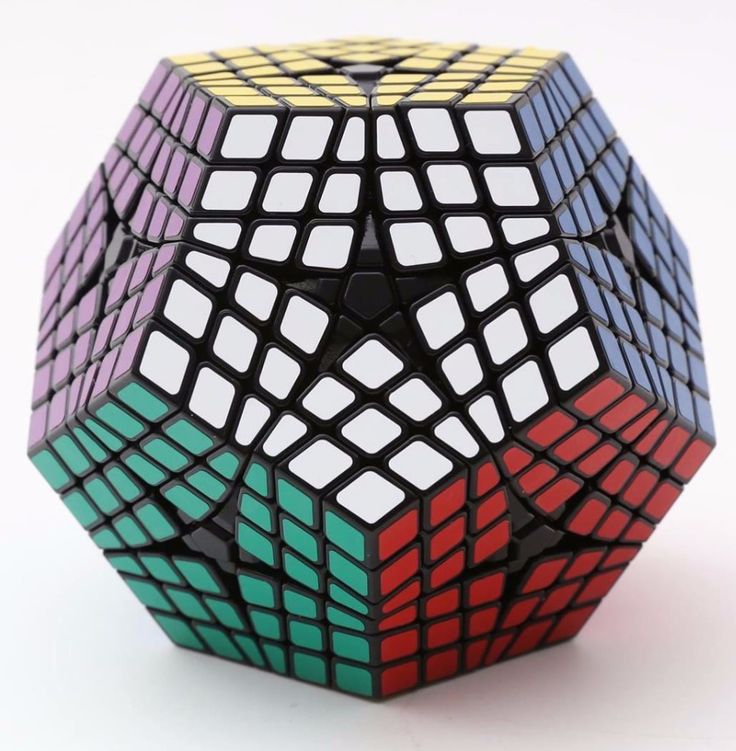 a rubik cube is shown on a white surface