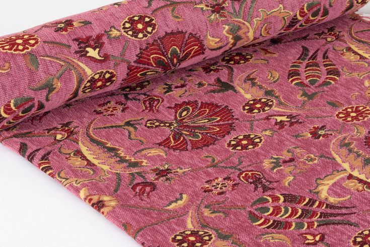 a red and gold paisley print fabric