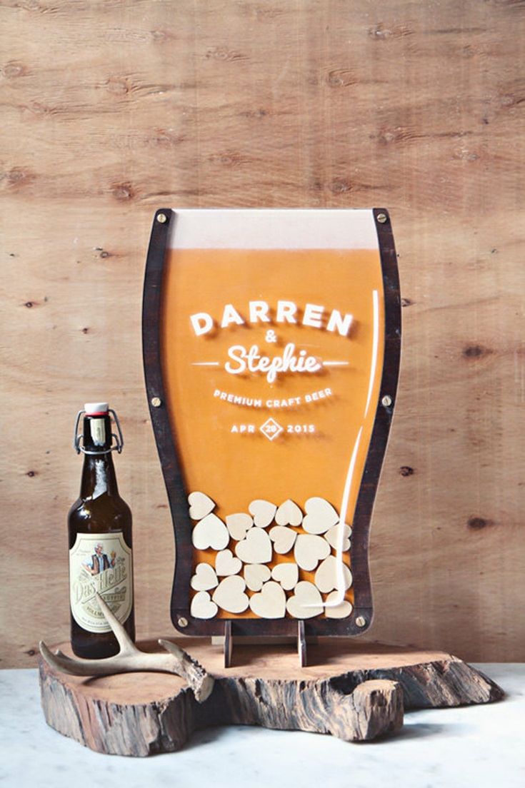 there is a beer bottle next to a wooden stand with logs on it and a bottle opener