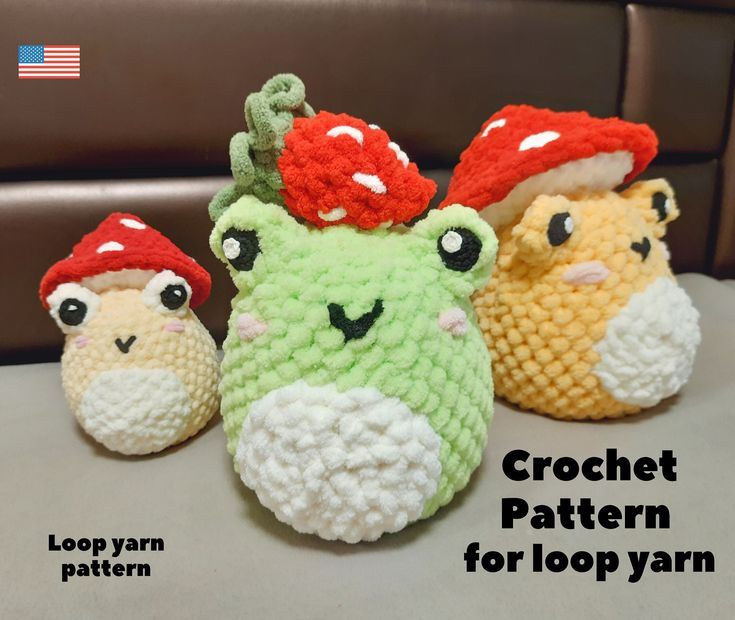 three crocheted stuffed animals with hats on them