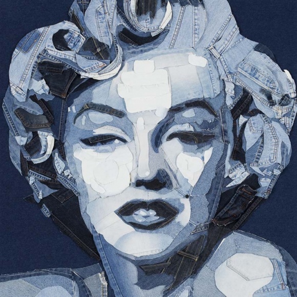 a painting of a woman's face made out of denims and other objects