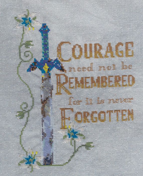 a cross stitched on to a piece of cloth with the words,'courage needs not to be remembered for it is given together '