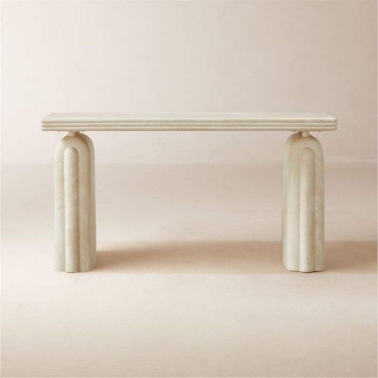 a white bench sitting on top of a table