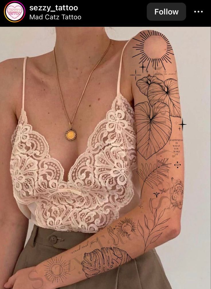 a woman with tattoos on her arm and chest