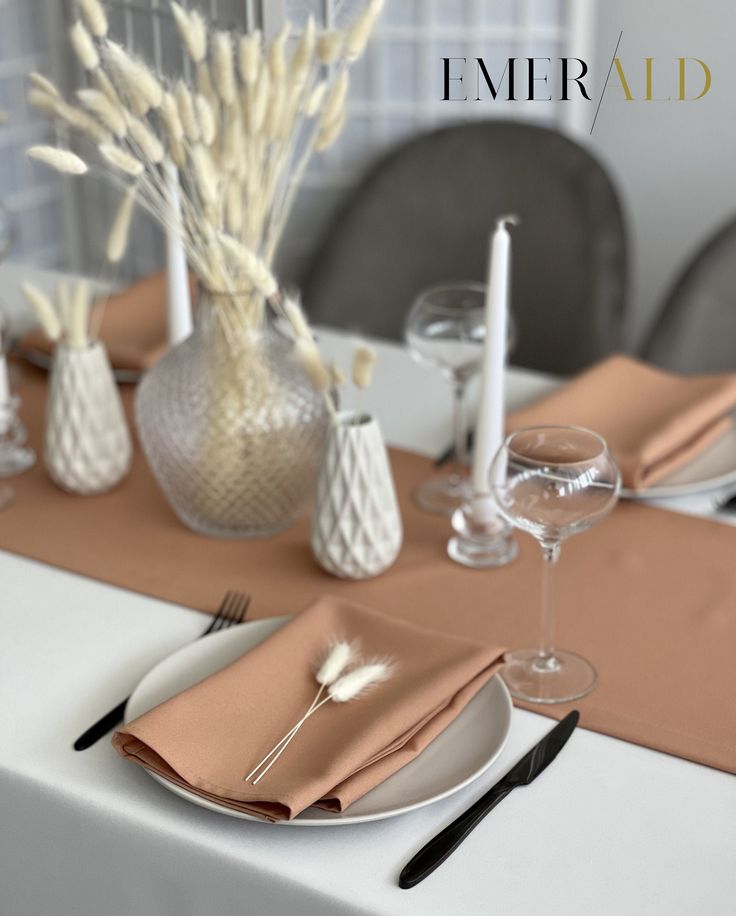 the table is set with silverware and napkins for an elegant dinner or party