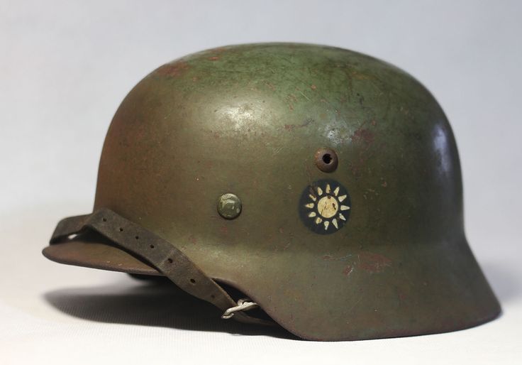 an old army helmet is shown on a white background