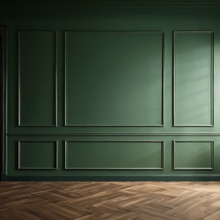 an empty room with green walls and parquet flooring in the center is shown