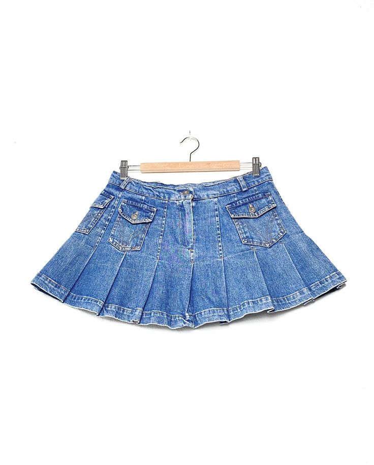 2000s Denim pleated skirt, vintage blue jeans mini skirt with low waist pleated bottom, multi pockets brand: none fit like: S/M circa: 2000s color: denim condition: great vintage condition measurement: waist: 38 cm back length: 34 cm Follow us on Instagram for the latest  @lividomilano www.instagram.com/lividomilano questions about this product? this item is clean and comes from a pet & smoke free building. every vintage piece we stock has been pre-loved + chosen for its unique qualities. fading 2000s Denim, Jeans Mini Skirt, Denim Pleated Skirt, Thrift Flip, Jean Mini Skirts, Skirt Vintage, Tennis Skirt, Denim Mini Skirt, Low Waist