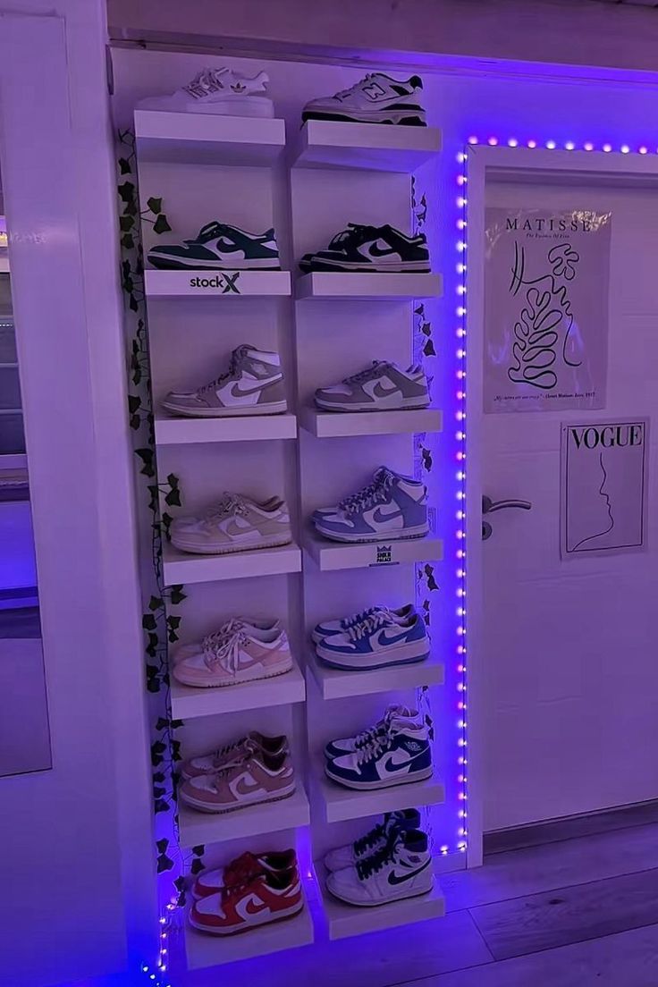 there is a shoe rack with shoes on it in the room that has blue lights