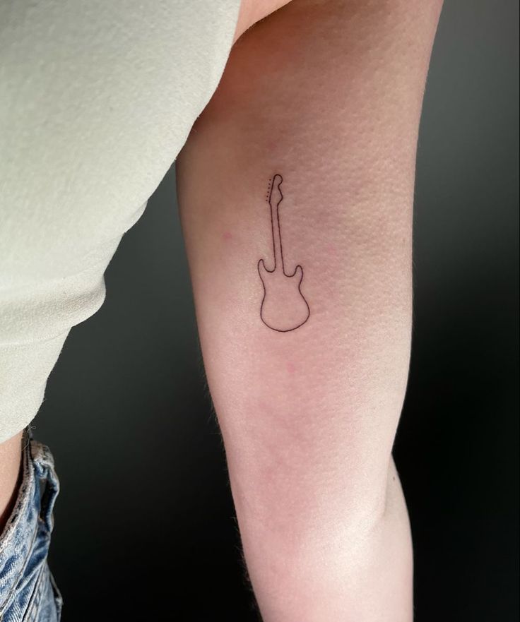 Guitar Tattoo Matching Guitar Tattoos, Tiny Guitar Tattoo Simple, Small Gutair Tattoos, Music Tattoo Designs Minimalist, Guitar Arm Tattoo, Cute Guitar Tattoos, Red Guitar Tattoo, Fender Strat Tattoo, Music Stick And Poke Tattoo