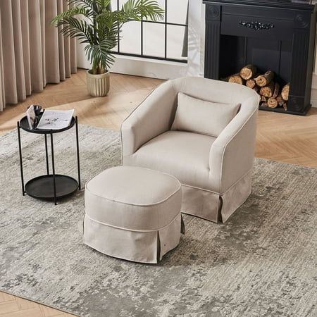 a living room with a chair, ottoman and fire place in the corner next to a fireplace