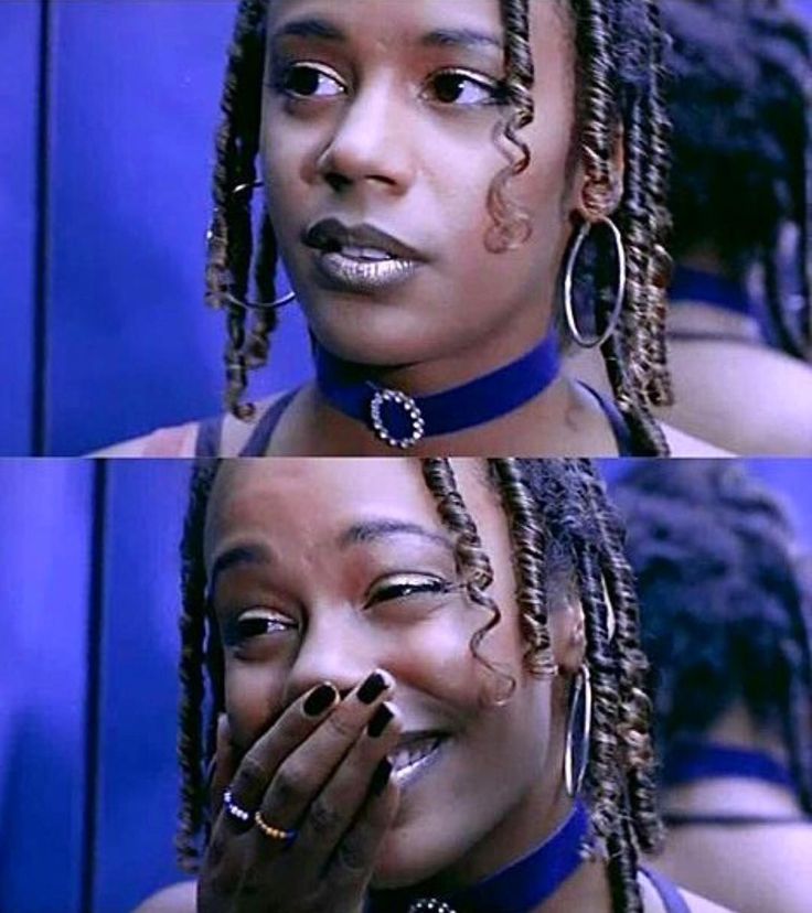 two women with dreadlocks on their heads and one has her hand over her mouth