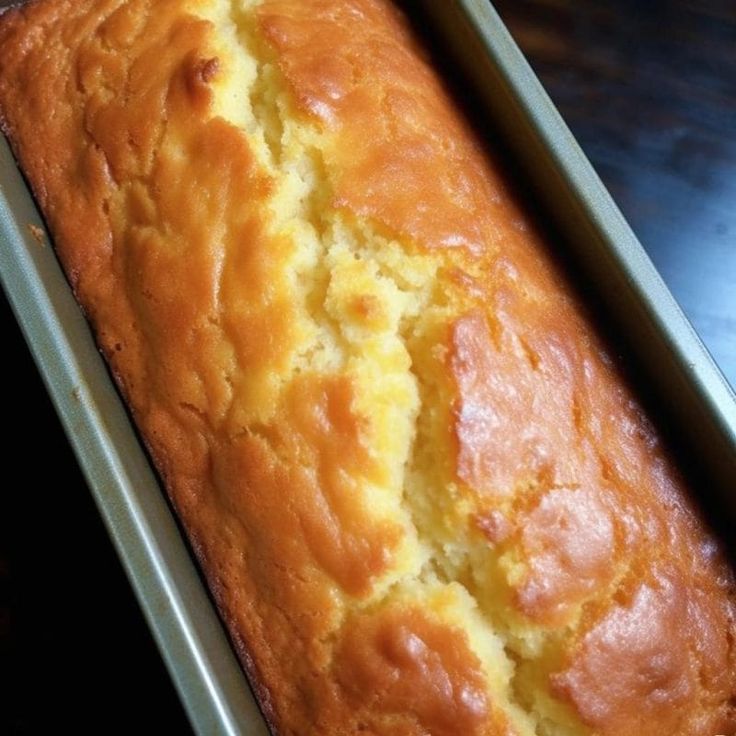 a loaf of bread sitting on top of a metal pan