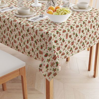 a bowl of fruit is sitting on a table with two plates and bowls of fruit