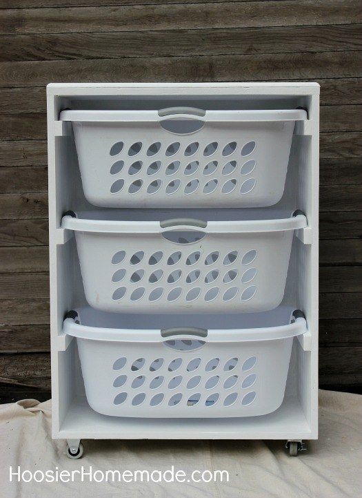 three white laundry baskets stacked on top of each other