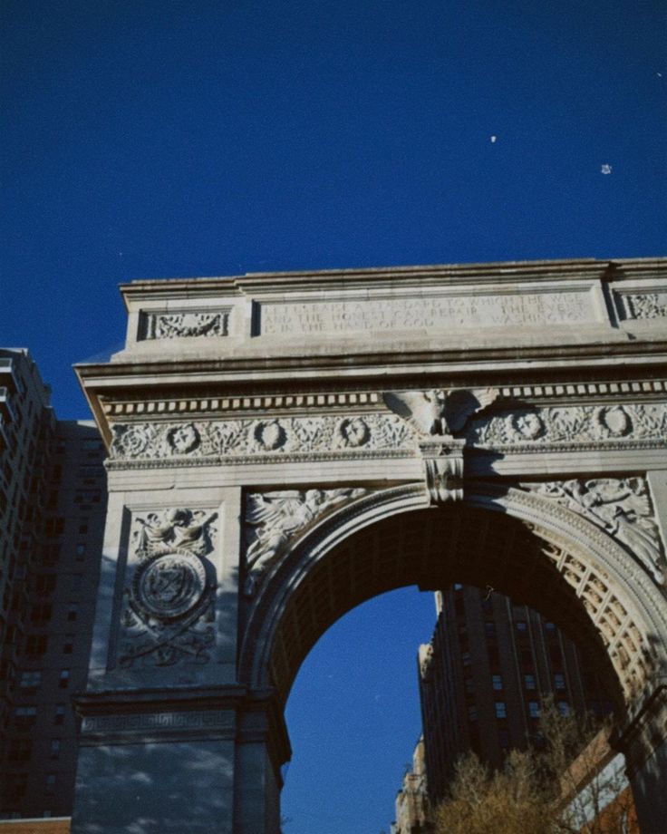 an arch in the middle of a city