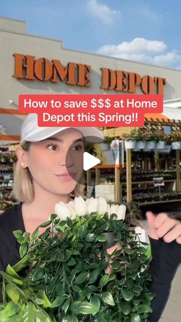 a woman holding a potted plant in front of a home depot