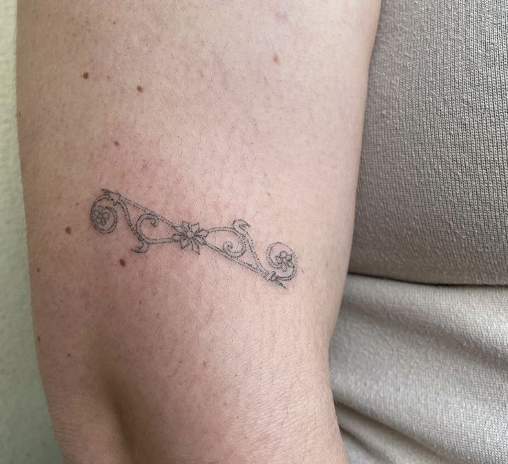 a woman with a tattoo on her arm