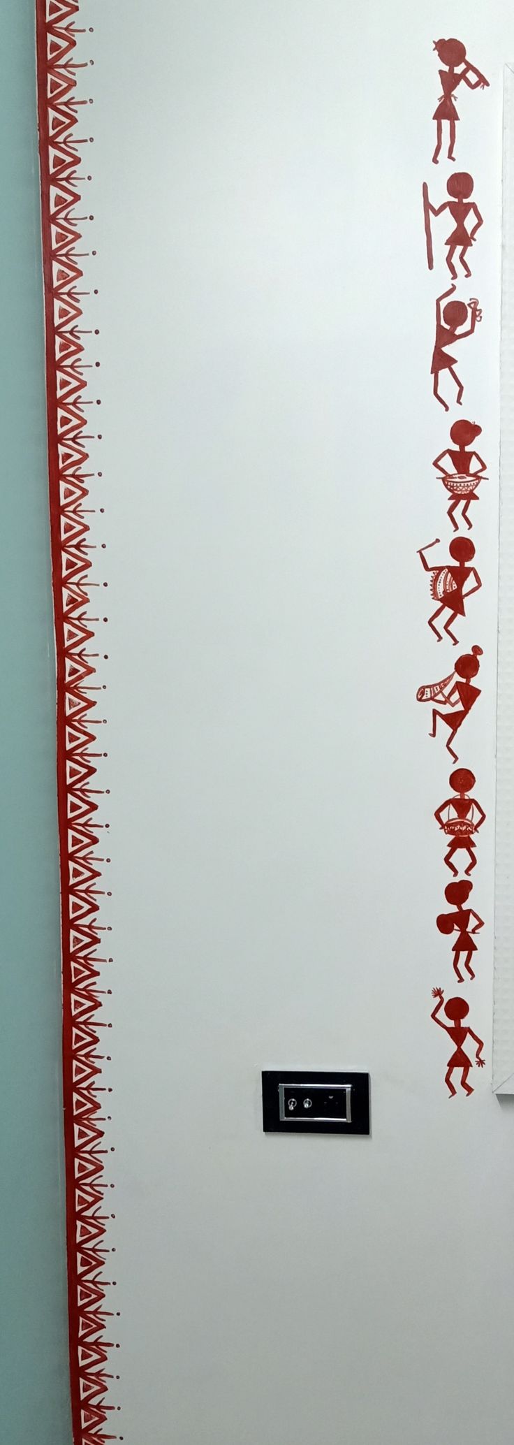 a white wall with red writing on it