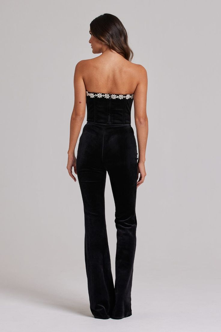 DESCRIPTION & FEATURES The DAVINA Black Pants are the perfect piece for those daring to make a statement. Made from our exclusive velvet, this simple statement trouser is perfect from day to night. Why not pair with our matching DAVINA Black Blazer and DAVINA BLACK Bra Top or our DAVINA Black Corset Top to complete the look? - Made from our exclusive velvet - Fully lined with satin for a smooth fit - Contrast velvet waistband with zip to side SIZE & FIT INFORMATION - Item runs to our size chart. Black Velvet Trousers, Sleeveless Corset Top, Black Velvet Corset, Velvet Corset Top, Black Bra Top, Nadine Merabi, White Corset Top, Velvet Corset, Black Corset Top