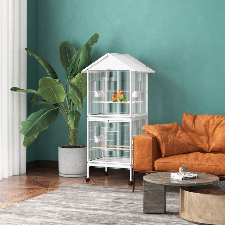 a living room with a couch, coffee table and birdcage