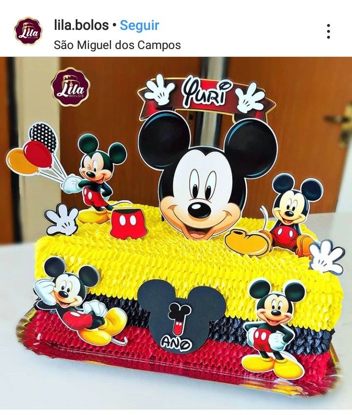 a mickey mouse birthday cake on a table