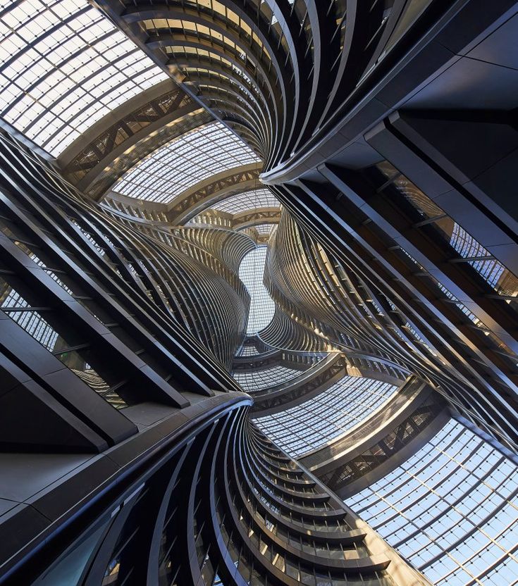 looking up at the spirally architecture of an office building