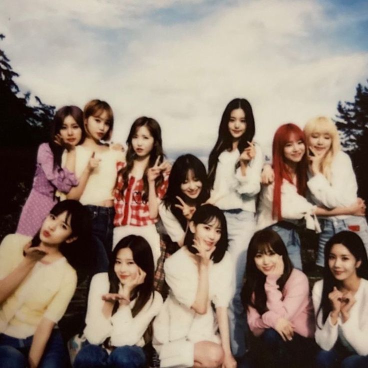 a group of young women sitting next to each other