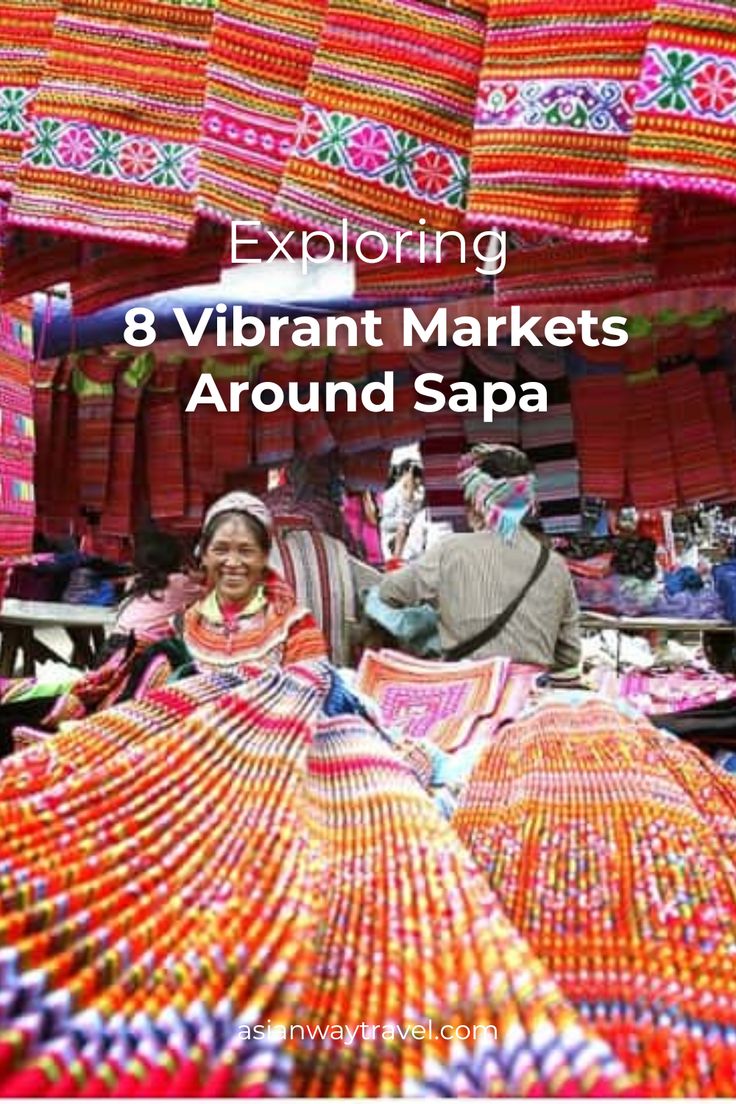 colorfully decorated umbrellas are hanging from the ceiling in an open air market area