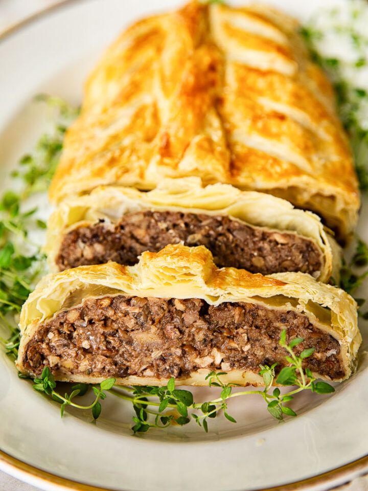 a meat and cheese pastry on a plate