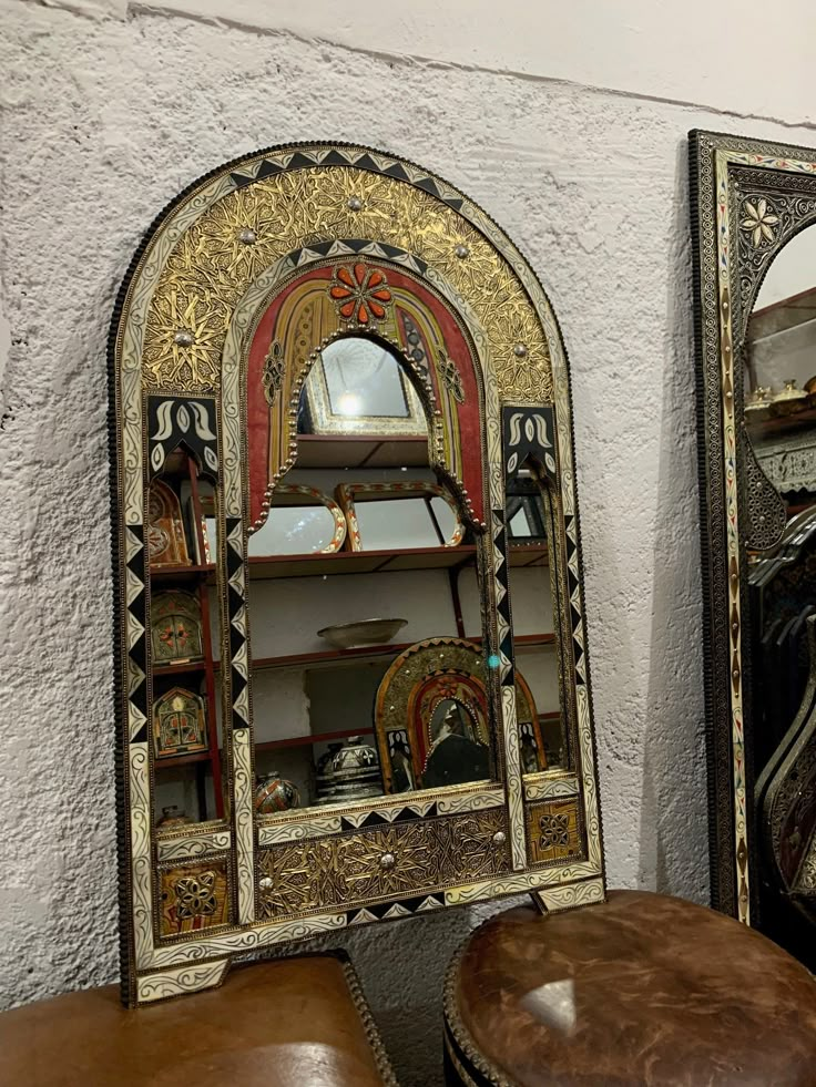 a mirror and a stool in a room Arch Mirror Wall, Inlay Mirror, Moroccan Henna, Wall Mirror Decor, Bone Inlay Mirror, Moroccan Mirror, Handmade Mirror, Handmade Mirrors, Luxury Mirror