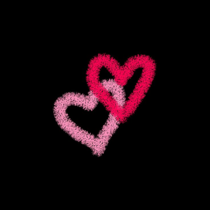 two hearts shaped in the shape of an x and y on a black background with pink dots