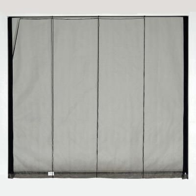 a white curtain with black trim hanging on the wall in front of a gray background