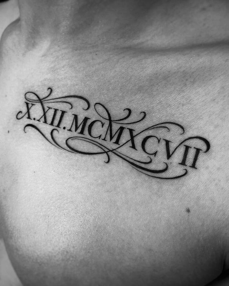 a chest tattoo with roman numerals and the word xxii mcmvt on it