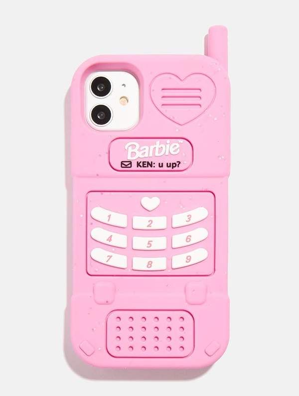 a pink cell phone case with hearts on the front and back cover, sitting on top of a white surface