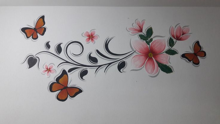 the wall is decorated with flowers and butterflies