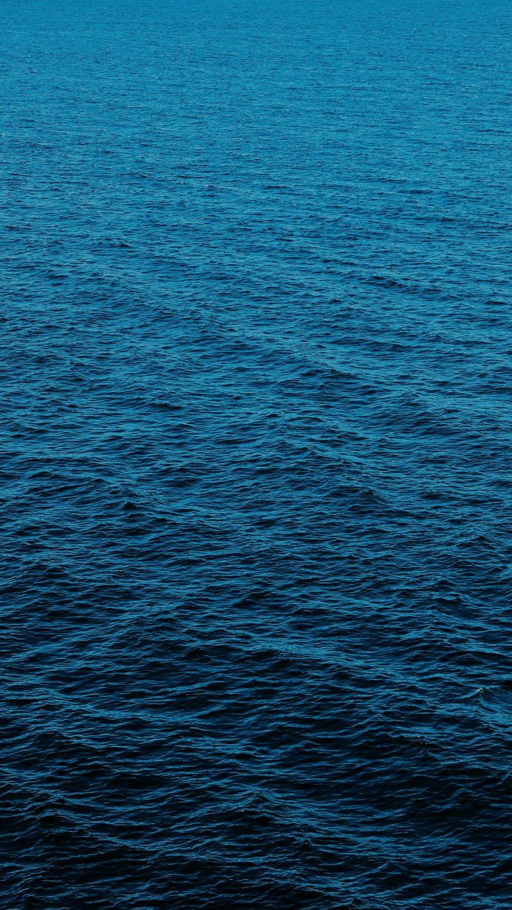 a boat floating on top of a large body of water