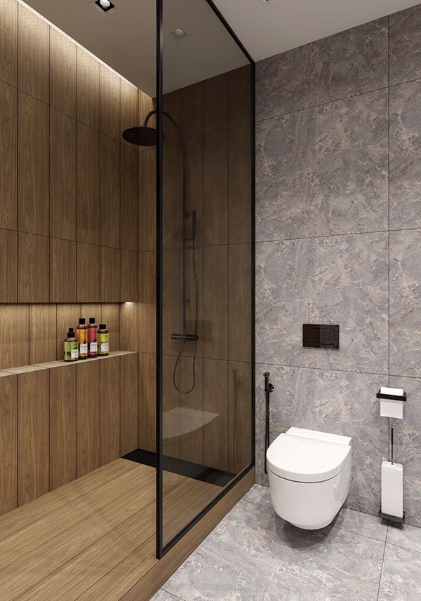 a bathroom with a toilet, shower and glass walls in it's center area