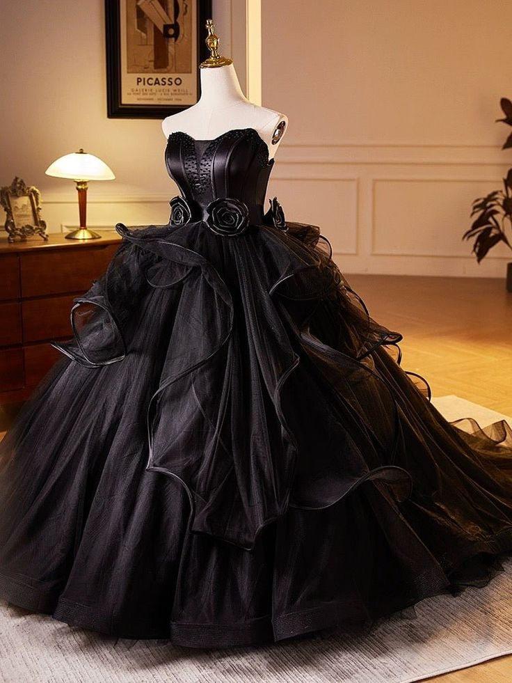 Embrace your inner gothic princess with this exquisite wedding dress. Crafted with meticulous attention to detail, this gown combines comfort and style. Black Masquerade Ball Gowns, Black Dramatic Dress, Goth Victorian Wedding Dress, Gothic Black Prom Dress, Goth Grad Dress, Royal Gothic Dress, Gothic Victorian Wedding Dress, Gothic Style Wedding Dress, Princess Wedding Dresses Black