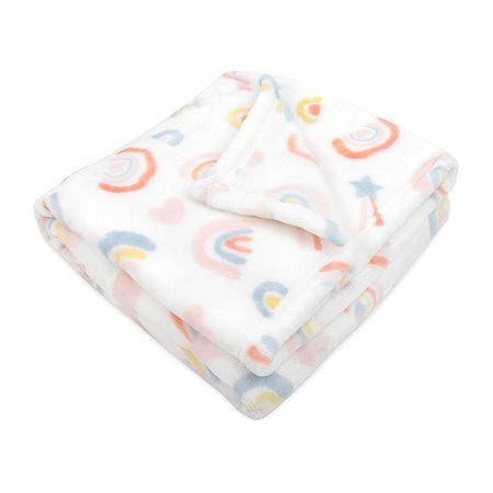 a white blanket with multicolored circles on it