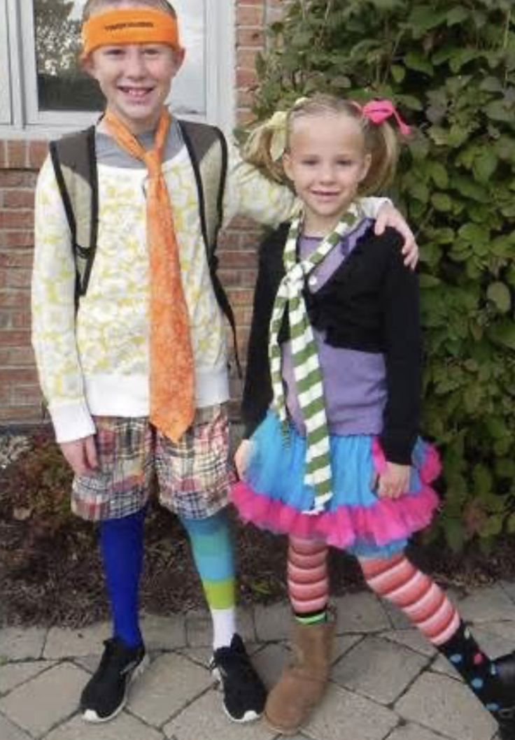 two young children standing next to each other