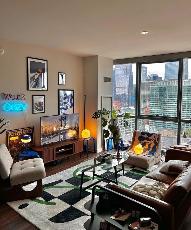 a living room filled with lots of furniture and large windows overlooking the cityscape