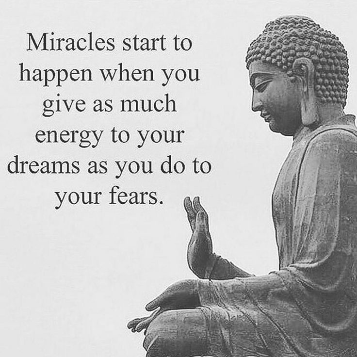 a buddha statue sitting on top of a wooden bench next to a quote that reads, miracles start to happen when you give as much energy to your dreams